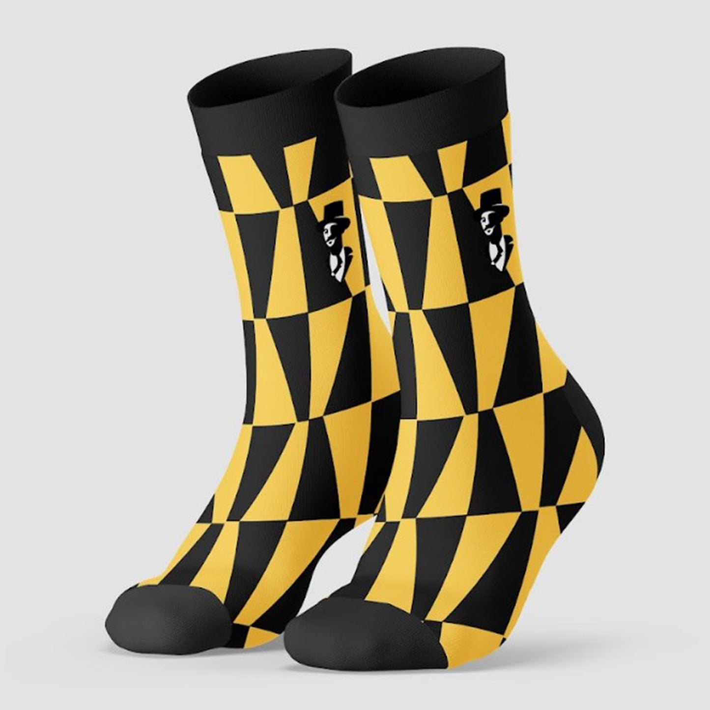 Black and yellow checkered socks with a pattern on a light gray background