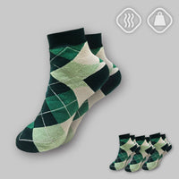 Green argyle socks on a gray background